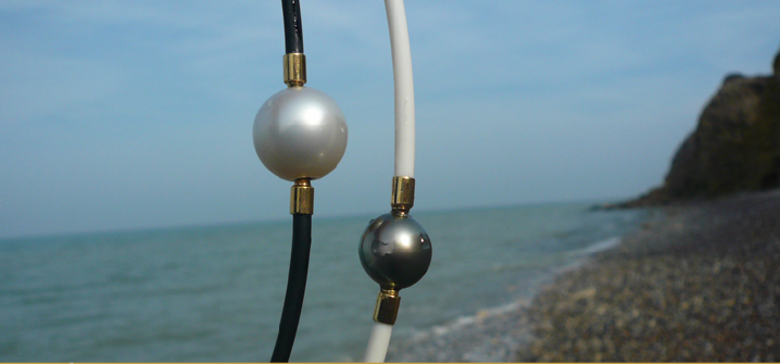 Australia white and Tahiti black pearls as interchangeable clasps on rubber necklaces